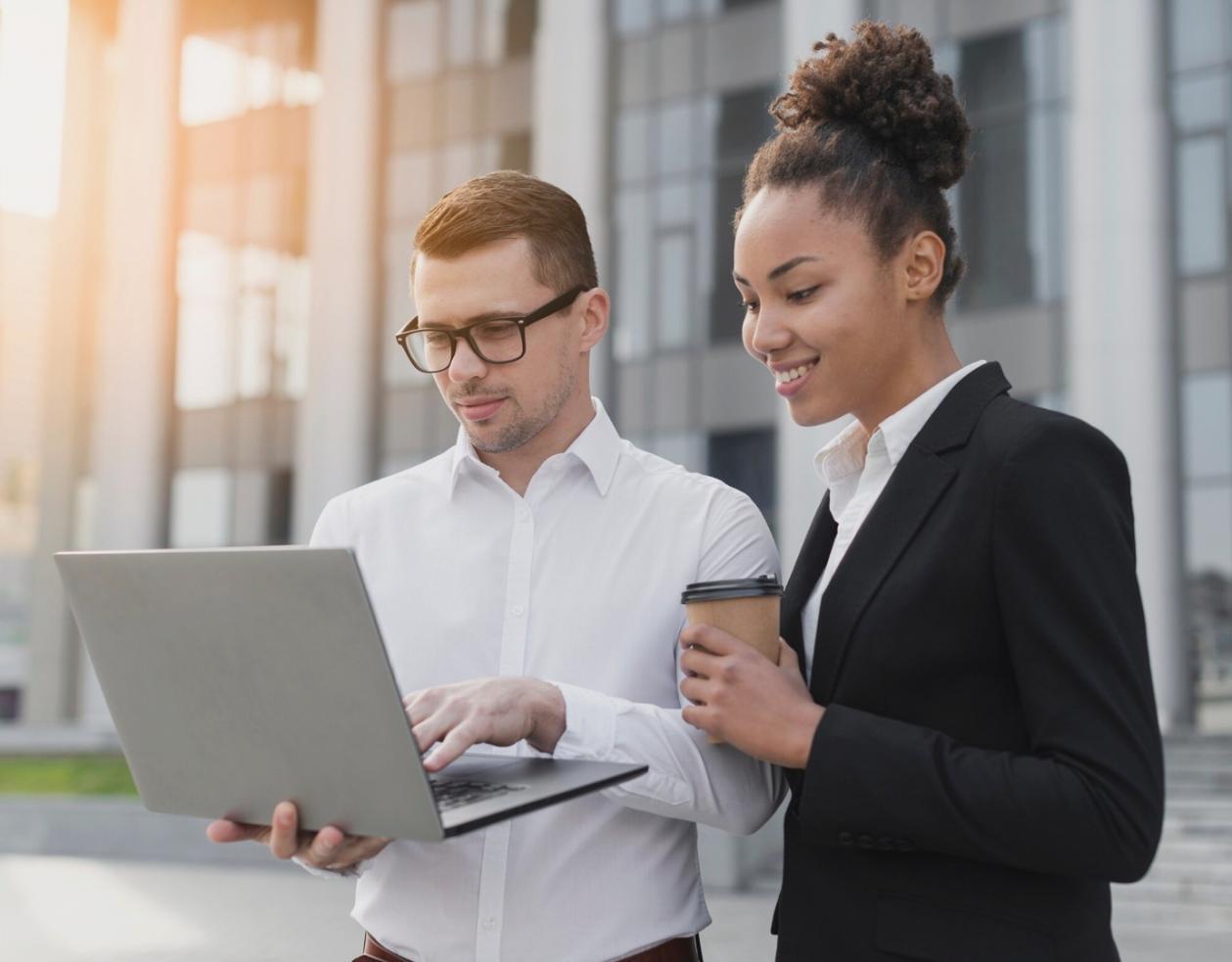Students collaborating on financial analysis project in modern workspace